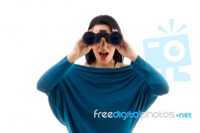 Portrait Of Female Looking Through Binocular On White Background… Stock Photo