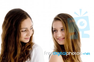 Portrait Of Girls Looking To Each Other Stock Photo