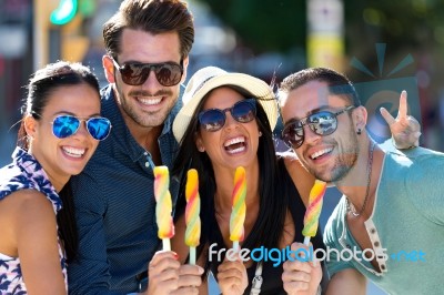 Portrait Of Group Of Friends Eating Ice Cream Stock Photo