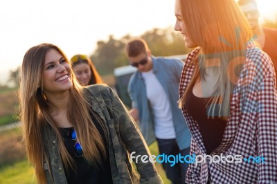 Portrait Of Group Of Friends Having Fun In Field Stock Photo