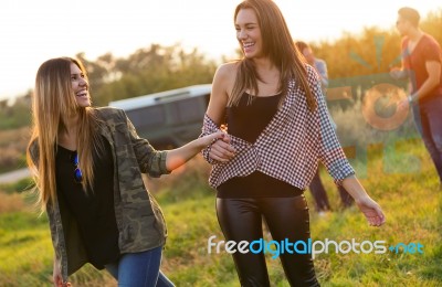 Portrait Of Group Of Friends Having Fun In Field Stock Photo