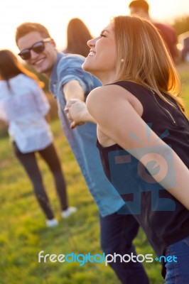 Portrait Of Group Of Friends Having Fun In Field Stock Photo