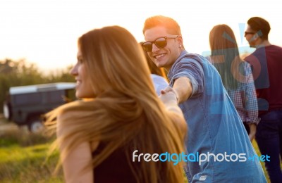 Portrait Of Group Of Friends Having Fun In Field Stock Photo