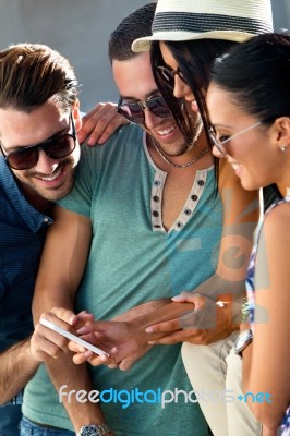 Portrait Of Group Of Friends Having Fun With Smartphones Stock Photo