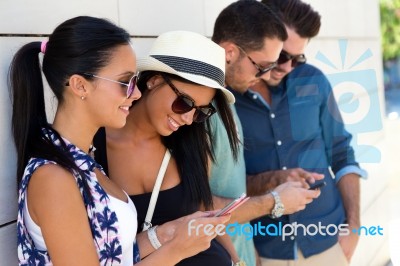 Portrait Of Group Of Friends Having Fun With Smartphones Stock Photo