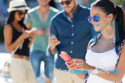 Portrait Of Group Of Friends Having Fun With Smartphones Stock Photo