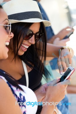 Portrait Of Group Of Friends Having Fun With Smartphones Stock Photo