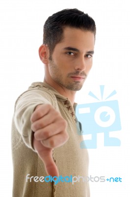 Portrait Of Guy Showing Thumbs Down Stock Photo