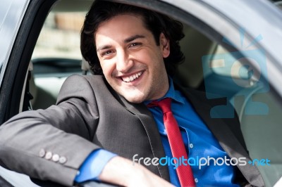 Portrait Of Handsome Guy Driving His Car Stock Photo