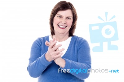 Portrait Of Happy Applauding Senior Woman Stock Photo