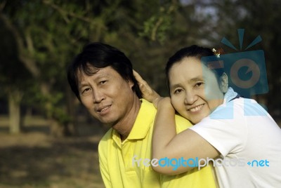 Portrait Of Happy Family In Park Stock Photo