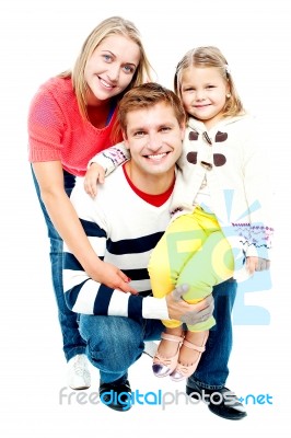 Portrait Of Happy Parents With Their Daughter Stock Photo