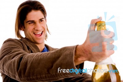 Portrait Of Man Holding Champagne Bottle Stock Photo