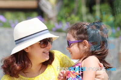 Portrait Of Mother And Daughter Outdoors Looking Each Other In S… Stock Photo