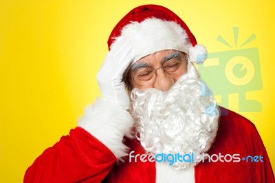 Portrait Of Santa Claus Suffering From Headache Stock Photo