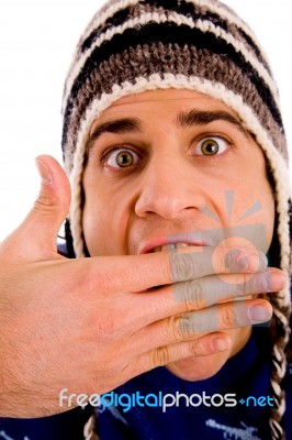 Portrait Of Shocked Man Wearing Woollen Cap Stock Photo