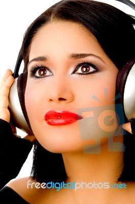 Portrait Of Smiling Beautiful Woman Listening Music Stock Photo