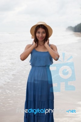 Portrait Of Smiling Face Of Young Asian Tan Skin Woman With Long… Stock Photo