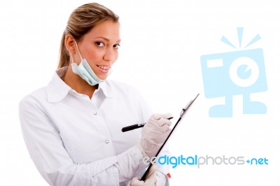 Portrait Of Smiling Medical Professional With Writing Pad Stock Photo