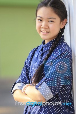 Portrait Of Thai 12s Years Girl Wearing Blue Shirt Standing Out Door With Toothy Smiling Face Happiness Emotion Stock Photo