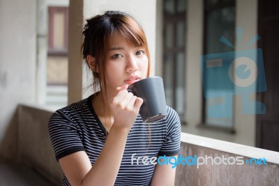 Portrait Of Thai Adult Beautiful Girl Drinking Coffee Stock Photo