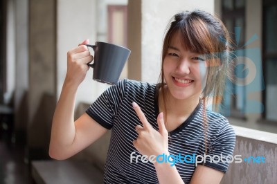 Portrait Of Thai Adult Beautiful Girl Drinking Coffee Stock Photo