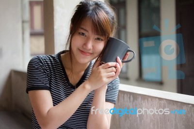 Portrait Of Thai Adult Beautiful Girl Drinking Coffee Stock Photo