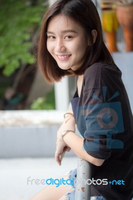 Portrait Of Thai Adult Beautiful Girl Relax And Smile Stock Photo