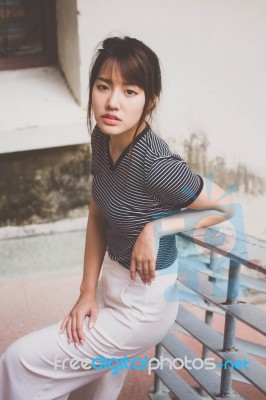 Portrait Of Thai Adult Beautiful Girl Relax And Smile Stock Photo