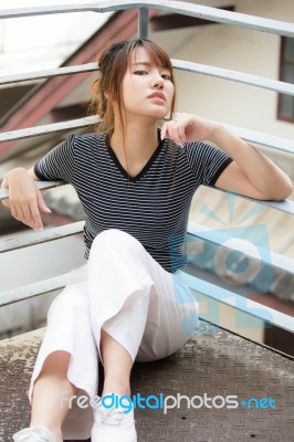 Portrait Of Thai Adult Beautiful Girl Relax And Smile Stock Photo