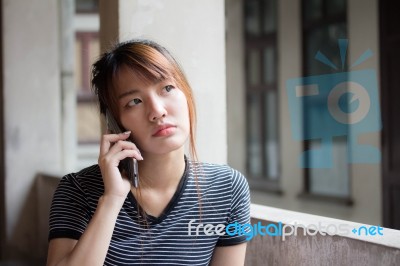 Portrait Of Thai Adult Beautiful Girl Using Her Smart Phone Selfie Stock Photo