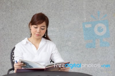 Portrait Of Thai Adult Businesswoman Beautiful Girl Read A Book Stock Photo