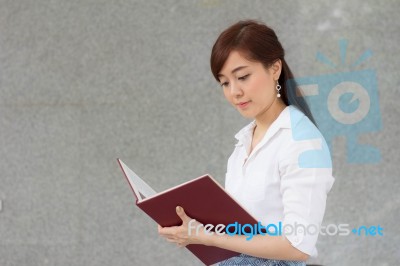 Portrait Of Thai Adult Businesswoman Beautiful Girl Read A Book Stock Photo