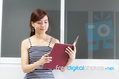 Portrait Of Thai Adult Businesswoman Beautiful Girl Read A Book Stock Photo