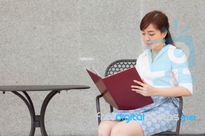 Portrait Of Thai Adult Businesswoman Beautiful Girl Read A Book Stock Photo