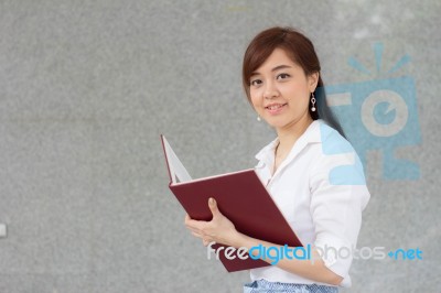 Portrait Of Thai Adult Businesswoman Beautiful Girl Read A Book Stock Photo