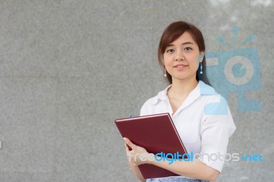 Portrait Of Thai Adult Businesswoman Beautiful Girl Read A Book Stock Photo