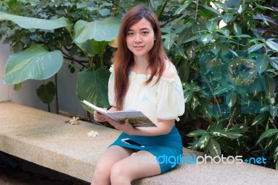 Portrait Of Thai Adult Businesswoman Beautiful Girl Read A Book Stock Photo