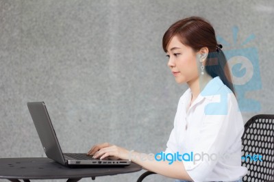 Portrait Of Thai Adult Businesswoman Beautiful Girl Using Computer Notebook Stock Photo