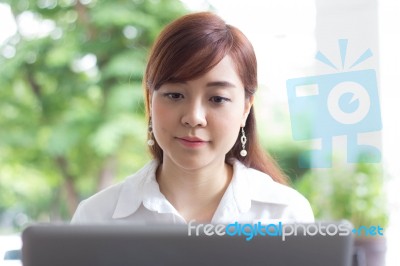 Portrait Of Thai Adult Businesswoman Beautiful Girl Using Computer Notebook Stock Photo