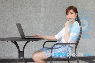 Portrait Of Thai Adult Businesswoman Beautiful Girl Using Computer Notebook Stock Photo