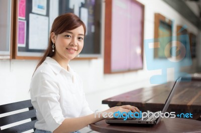 Portrait Of Thai Adult Businesswoman Beautiful Girl Using Computer Notebook Stock Photo