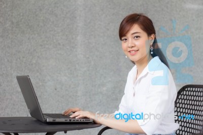 Portrait Of Thai Adult Businesswoman Beautiful Girl Using Computer Notebook Stock Photo