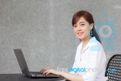 Portrait Of Thai Adult Businesswoman Beautiful Girl Using Computer Notebook Stock Photo