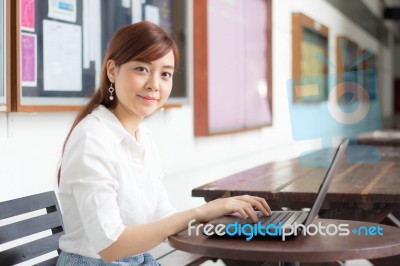 Portrait Of Thai Adult Businesswoman Beautiful Girl Using Computer Notebook Stock Photo