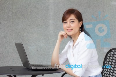 Portrait Of Thai Adult Businesswoman Beautiful Girl Using Computer Notebook Stock Photo