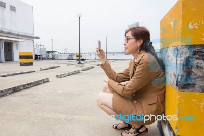 Portrait Of Thai Adult Businesswoman Beautiful Girl Using Her Smart Phone Stock Photo