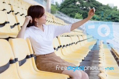 Portrait Of Thai Adult Businesswoman Beautiful Girl Using Her Smart Phone Selfie Stock Photo