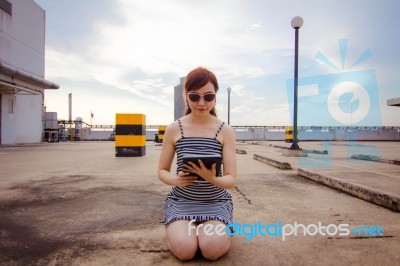 Portrait Of Thai Adult Businesswoman Beautiful Girl Using Her Tablet Stock Photo