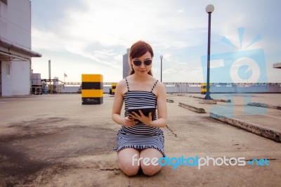 Portrait Of Thai Adult Businesswoman Beautiful Girl Using Her Tablet Stock Photo